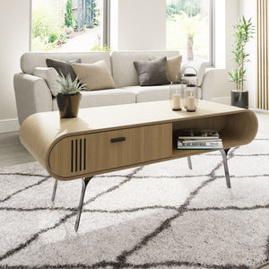 Jual Furnishings Milano Collection coffee table in oak finish with black metal legs. Features a sleek curved design, a sliding door, and open shelving for stylish storage. Perfect for modern and contemporary living spaces