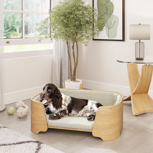 Jual Furnishings luxury oak pet bed with a soft beige cushion, designed to complement our matching oak furniture collection. A happy spaniel lounges in comfort, blending seamlessly with our stylish oak side table and modern interior decor