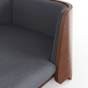 Close-up detail of the Jual Furnishings modern walnut pet bed, highlighting the smooth curved wood and soft gray fabric. Crafted from high-quality walnut veneer for a warm, rich finish. Complements the matching Jual Furnishings walnut lamp table for a stylish set