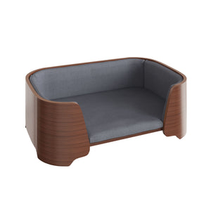 Jual Furnishings luxury pet bed featuring a curved walnut wood frame with a smooth finish, complemented by plush gray fabric cushioning, designed for comfort and modern style, set against a white background
