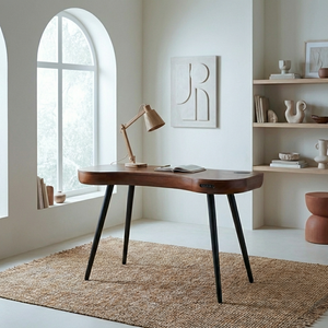 walnut speaker desk in a warm tone setting